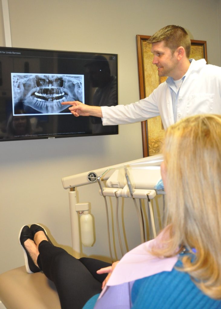 Dr. Barrows showing a patient her dental x-ray